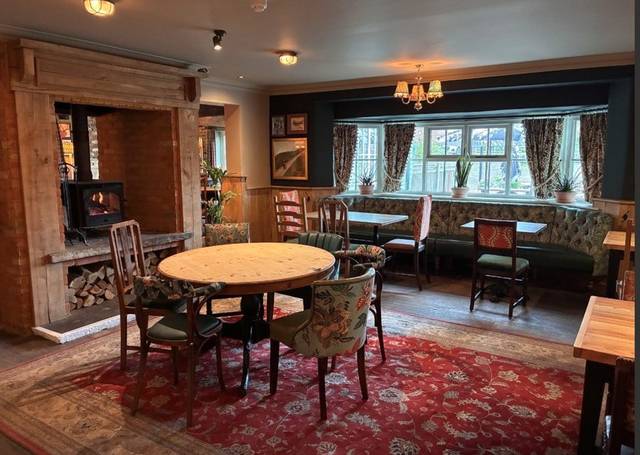 Refurbished pub dining room with fireplace